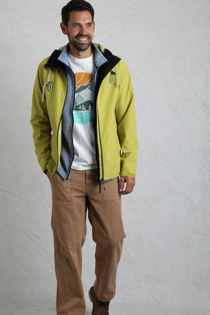 Weird Fish mens waterproof jacket tarragon in light green worn by man with casual outfit