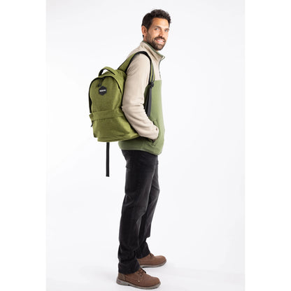 Man wearing a Weird Fish green Nevis backpack on a white background