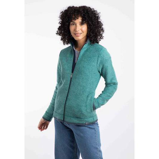 Front view of a Weird Fish womens Ariana zip grid fleece green worn by woman with curly hair and blue jeans