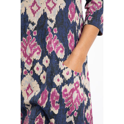 Close up of a womens Weird Fish Arielle tunic in petrol blue with an abstract pink-purple and cream pattern with front pockets on a white background.