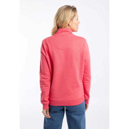 Back view of a woman wearing a Weird Fish Avery 1/4 zip plain sweatshirt in Flamingo Pink with elasticated cuffs and bottom hem