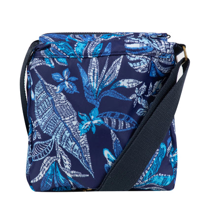 Back view of a Weird Fish Kait cross body bag in navy with a blue tropical leaf print and adjustable shoulder strap.