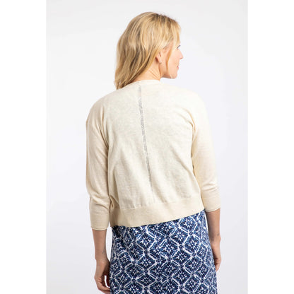 Back view of a woman wearing a Weird Fish Limon 3/4 sleeve shrug cardigan in Light Cream