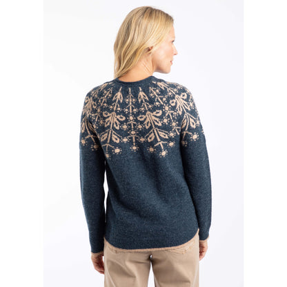 Back view of a woman wearing a Weird Fish navy Miska jumper with a beige Fair Isle pattern and beige trousers.