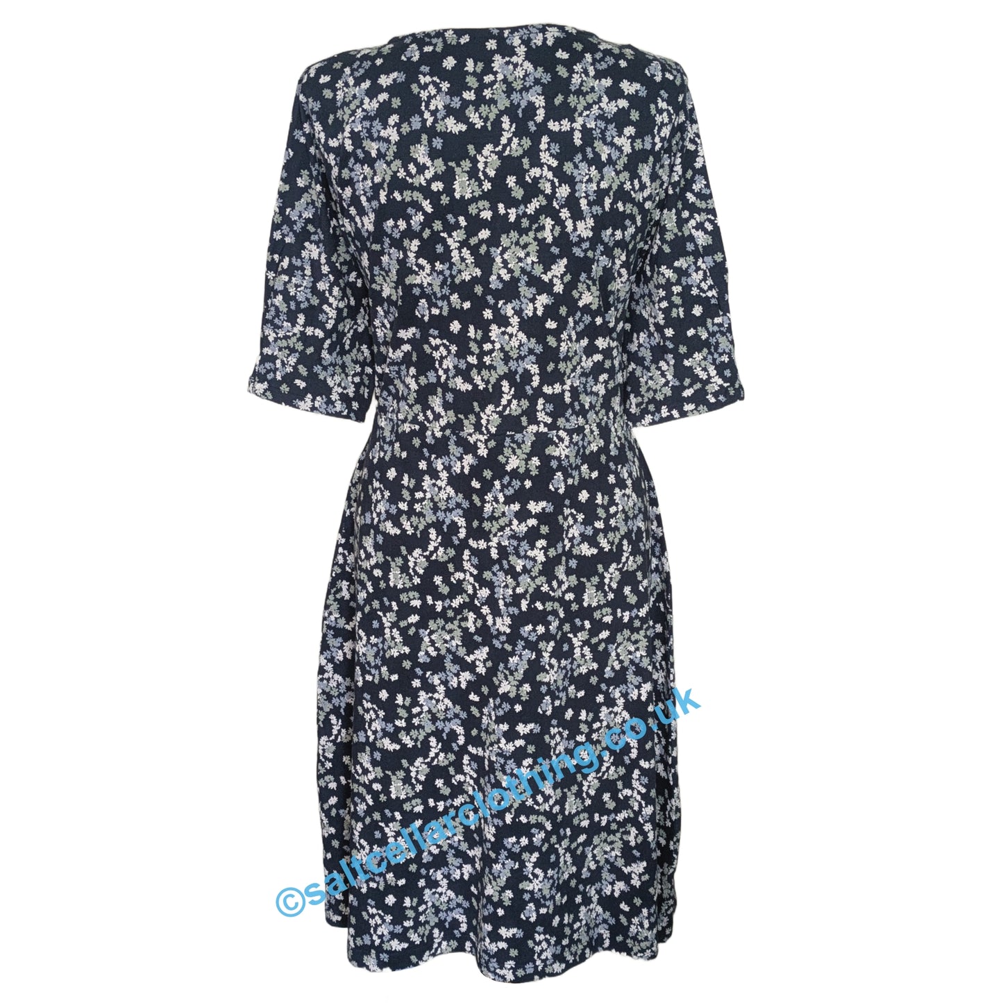 Back view of a womens Weird Fish Cassandra Ink navy floral dress on a white background