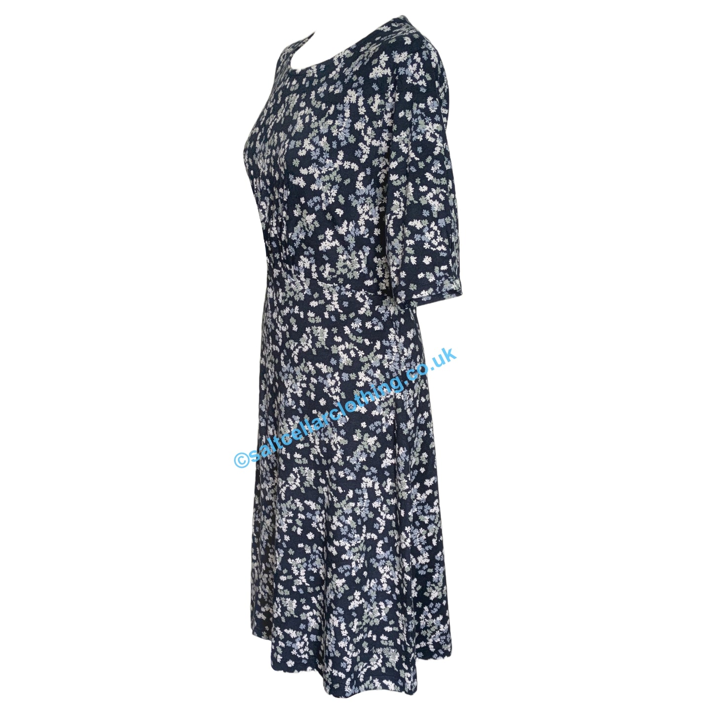 Side view of a womens Weird Fish Cassandra Ink navy floral dress on a white background