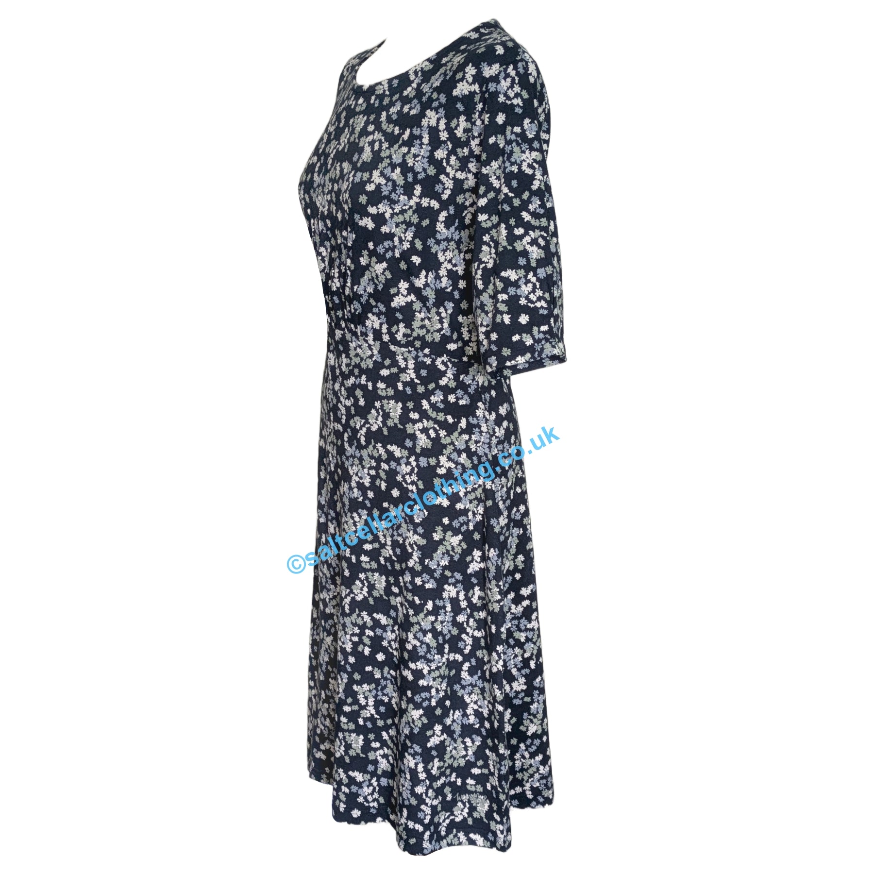 Side view of a womens Weird Fish Cassandra Ink navy floral dress on a white background