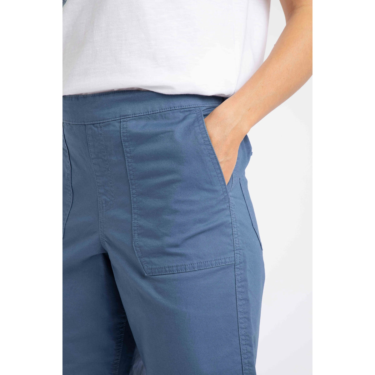 Close-up view of a hip pocket on a pair of womens Weird Fish flat front Kinnie shorts in Faded Blue with elastic waist and hip pockets.