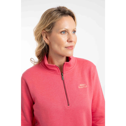 Close-up view of the 1/4 zip neckline and chest logo of a woman wearing a Weird Fish Avery sweatshirt in Flamingo Pink.