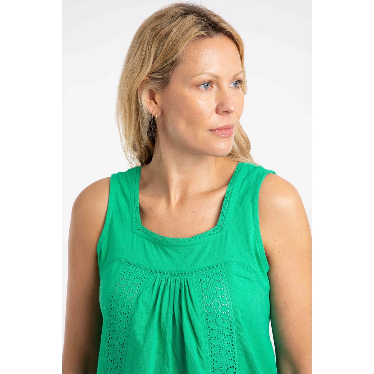 Close-up view of the lace front detail of a woman wearing a Weird Fish Chelle square neck vest in Gumdrop Green
