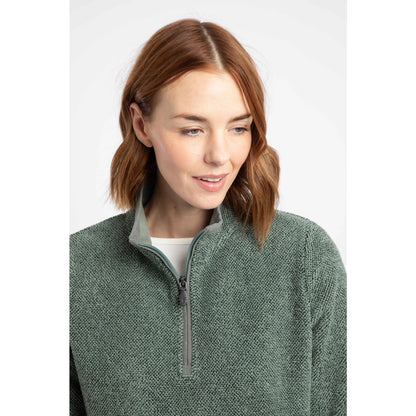 Close-up view of a woman wearing a Weird Fish 1/4 zip Sarah fleece in Military Green