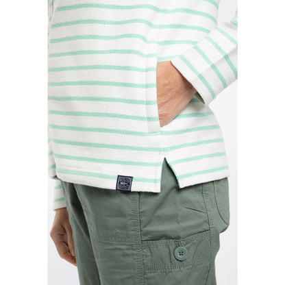 Close-up view of the side pocket and logo patch of a women's Weird Fish Catalina full zip loopback hoodie in an Apple Mint green and white stripe pattern