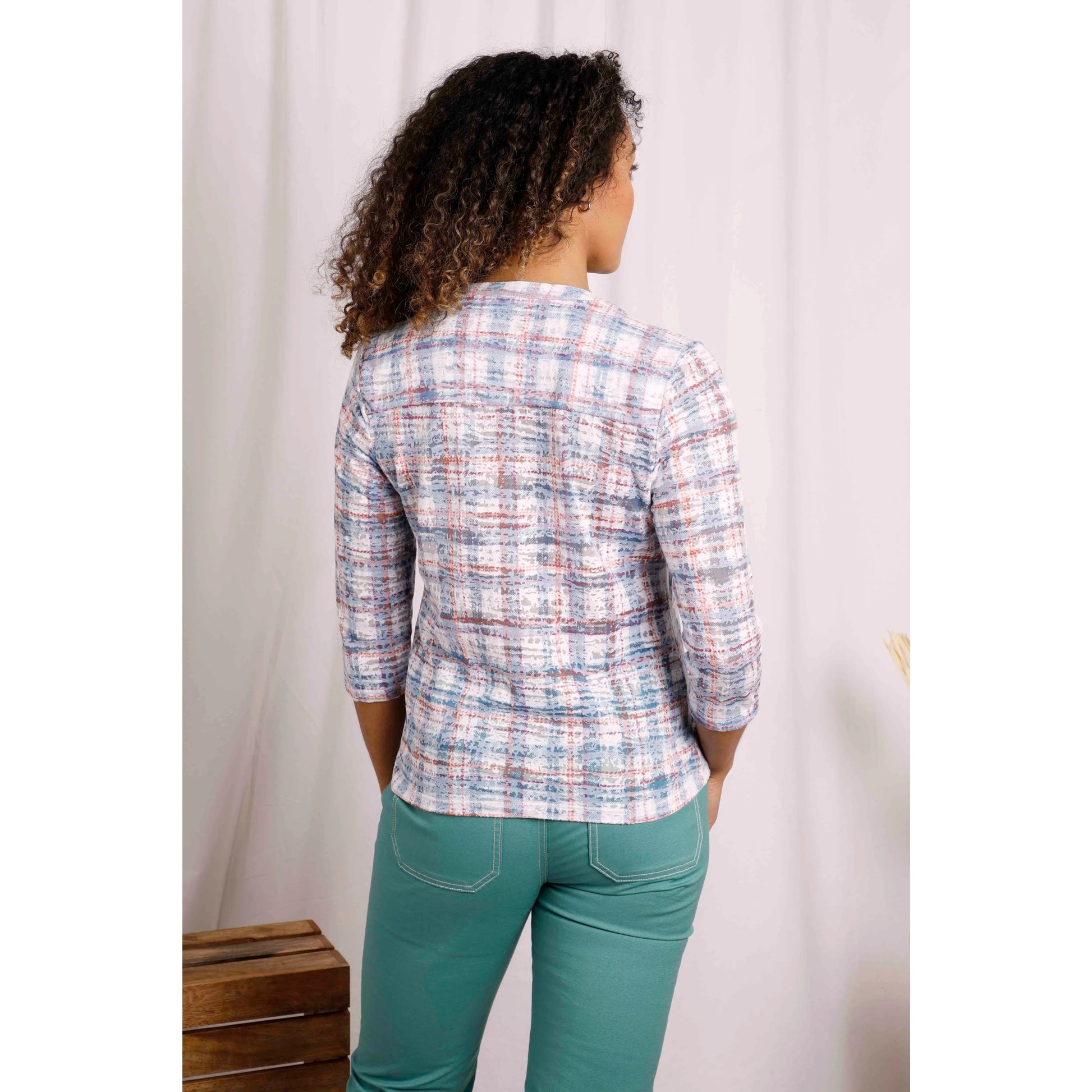 Back view of Weird Fish womens Fes check shirt in Pale Denim Blue worn by a woman with three-quarter sleeves