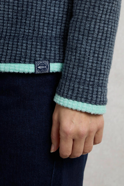 Weird Fish womens fleece navy with textured fabric and mint trim on sleeve and hem