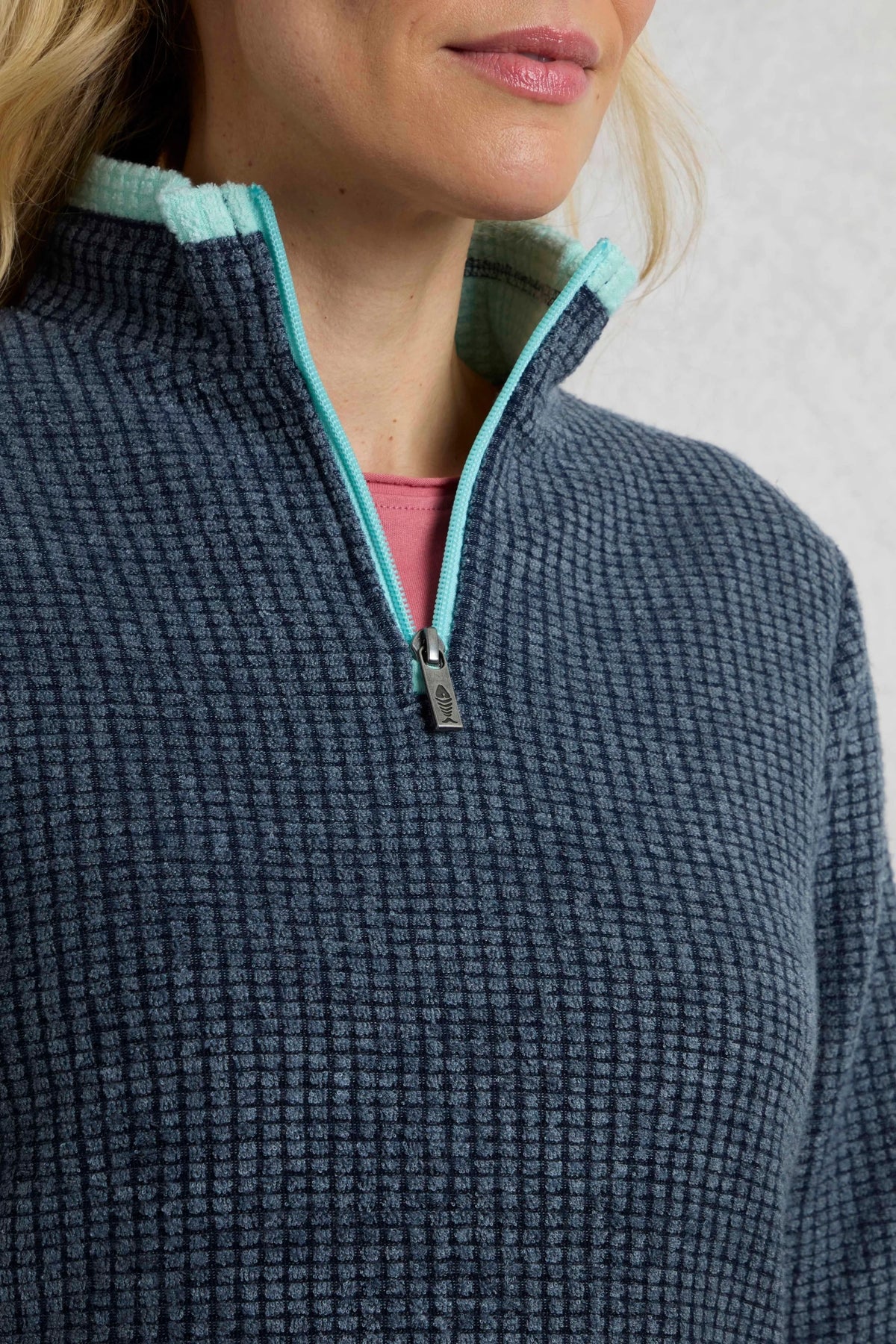 Weird Fish womens fleece navy with textured fabric and turquoise zipper detail close-up