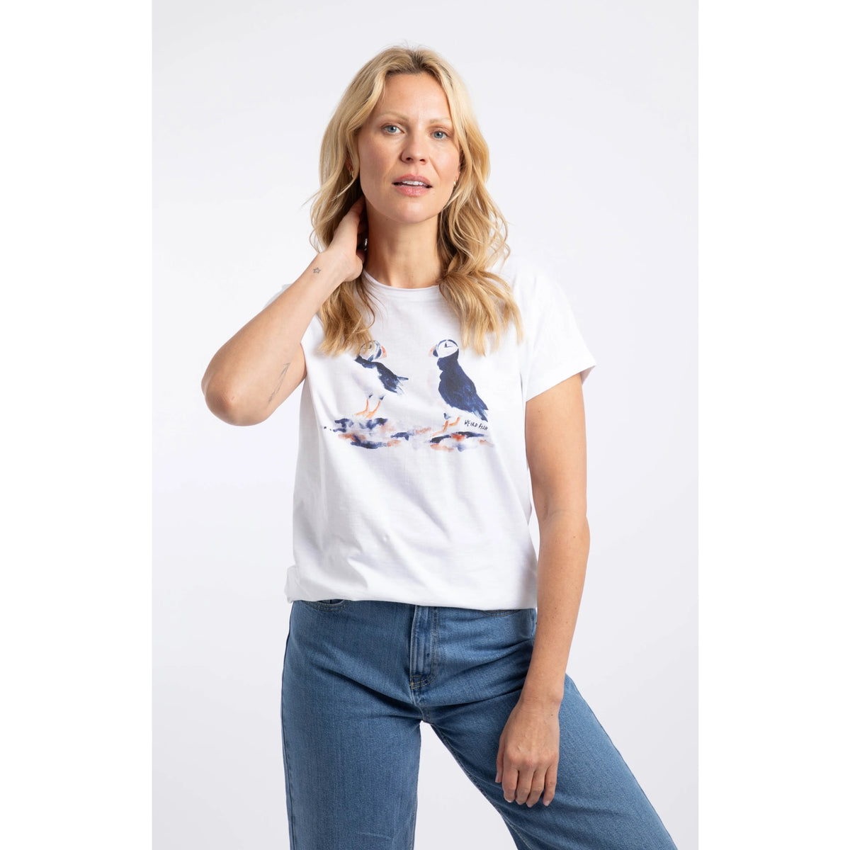 Front view of a woman wearing a Weird Fish white Puffin print t-shirt.