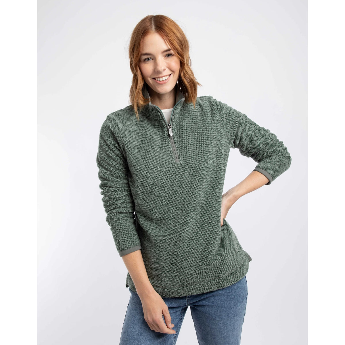 Front view of a woman wearing a Weird Fish 1/4 zip Sarah fleece in Military Green
