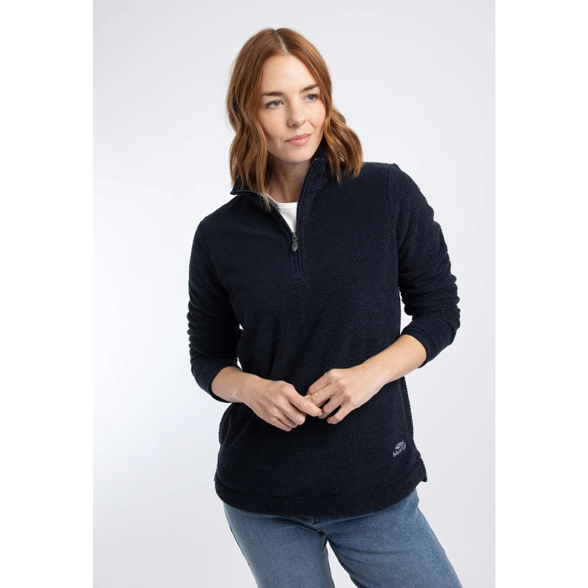 Front view of a woman wearing a Weird Fish 1/4 zip Sarah fleece in Midnight Navy