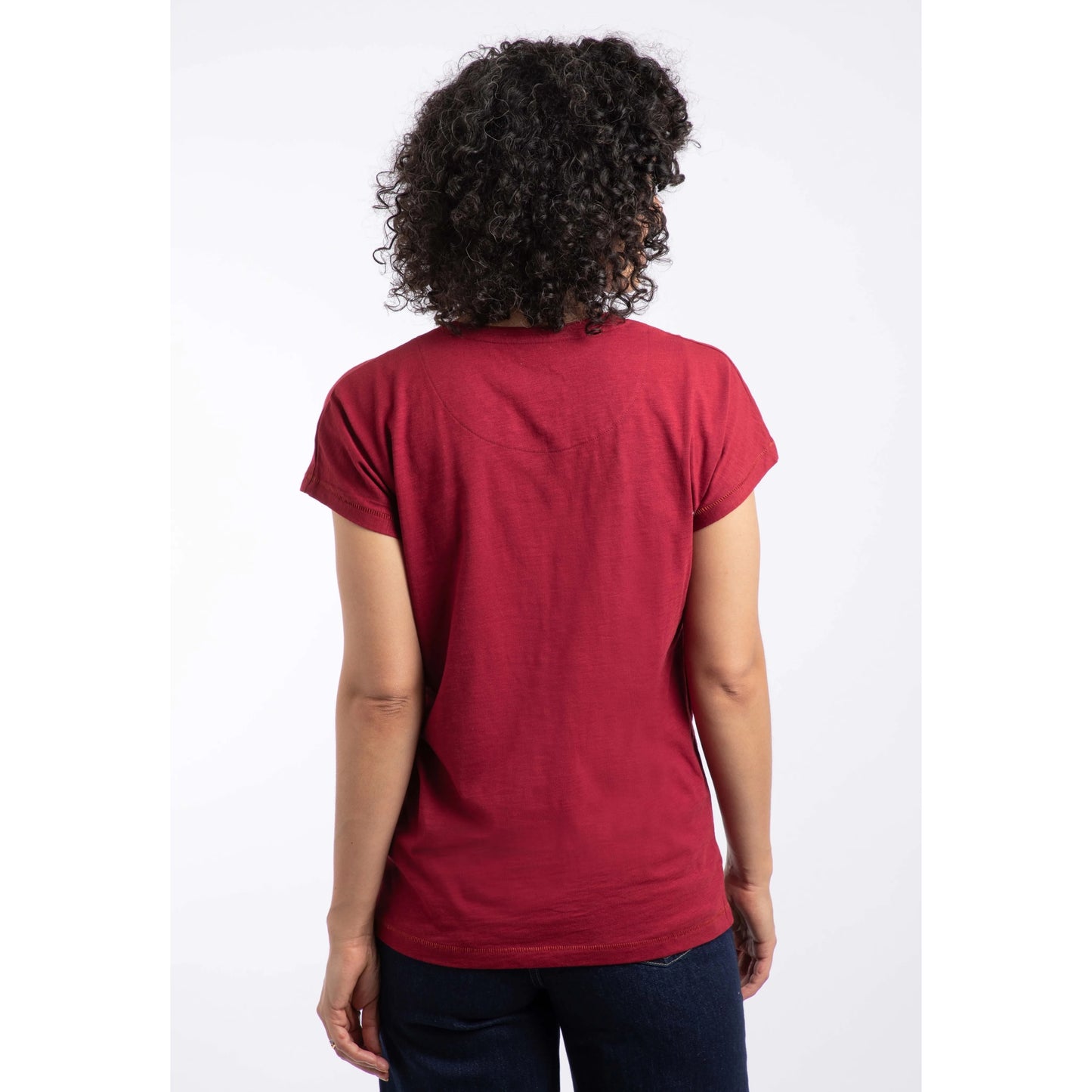 Person wearing a red t-shirt on a white background