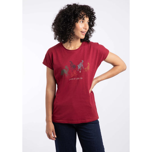 Woman wearing a red t-shirt with colorful graphic design on a white background