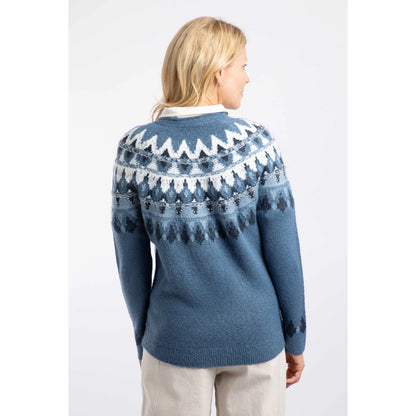Back view of a woman wearing a Weird Fish knitted Lowell jumper in Ash Blue, with a Fair Isle pattern across the chest and shoulders.