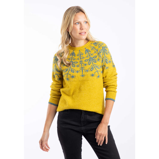 Front view of a woman wearing a yellow Weird Fish Miska knitted jumper with a beige Fair Isle pattern and beige trousers.
