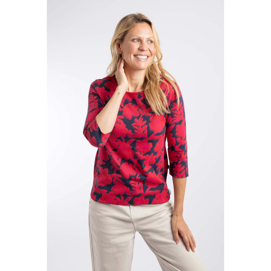 Front view of a woman wearing a Weird Fish three-quarter sleeve Pinto t-shirt in Cranberry Red with a bold floral pattern.