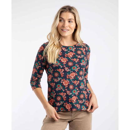 Woman wearing a Weird Fish Pinto 3/4 sleeve t-shirt in a floral pattern on a white background