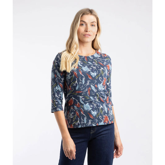 Woman wearing a Weird Fish floral print t-shirt with a plain background