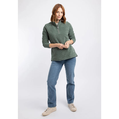 A woman wearing a Weird Fish 1/4 zip Sarah fleece in Military Green with blue jeans.