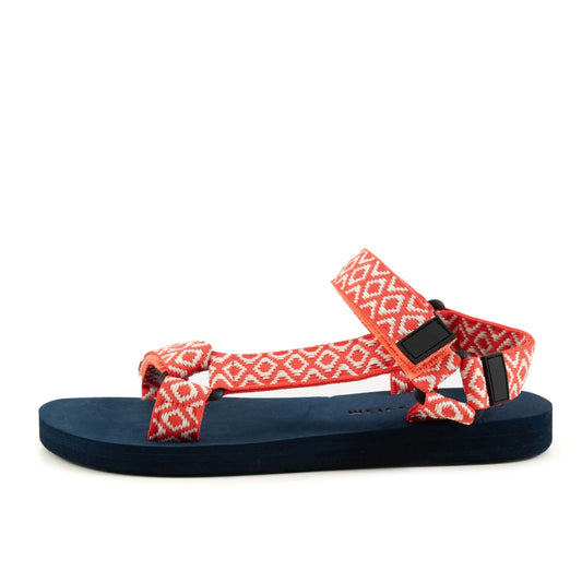 Main view of a womens Weird Fish Trek webbing velcro strap sandal in coral with an Aztec style pattern.