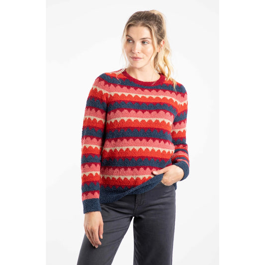 Woman wearing a Weird Fish Tyla cosy knit jumper in Antique Cherry Red and blue stripes on a white background