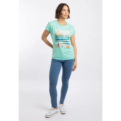 Woman wearing a Weird Fish Walking Club t-shirt in Apple Mint with a beach and dog walker print on a white background