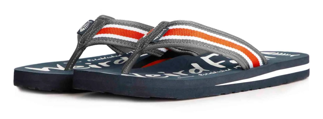 Men's Waterford flip flops from Weird Fish in Navy with a white logo print on the soles and a woven textile strap.