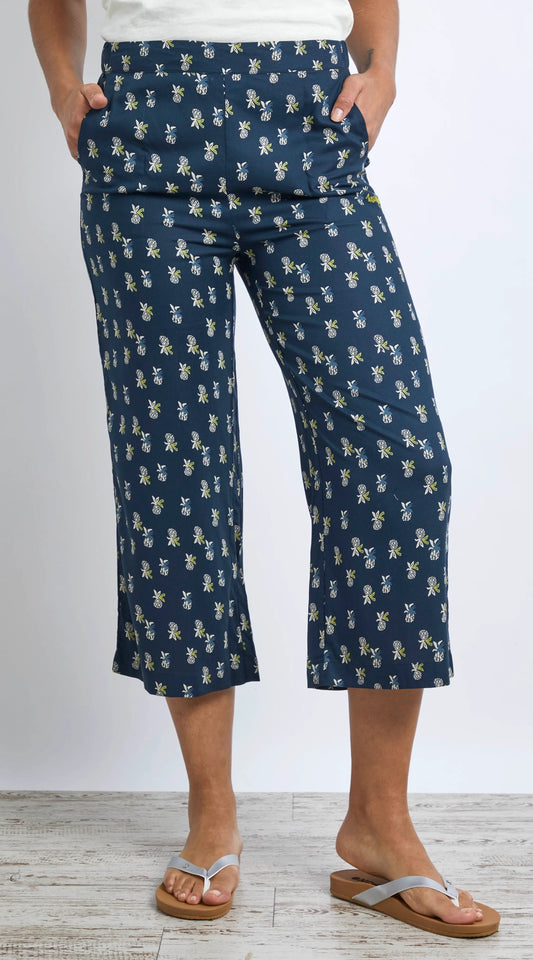 Women's Weird Fish Tresco crop trousers in dark blue with a pineapple pattern.