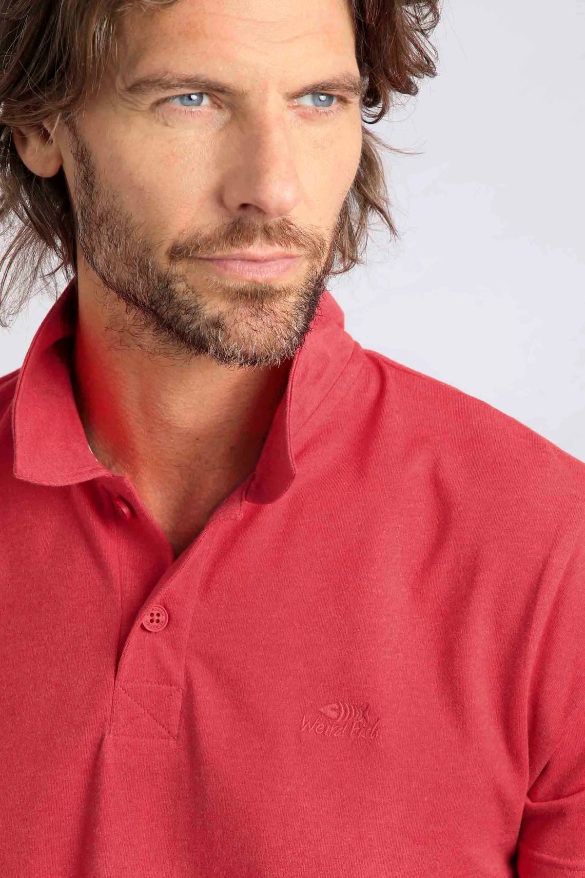 Men's two button neckline Jetstream polo shirt from Weird Fish in Radical Red.