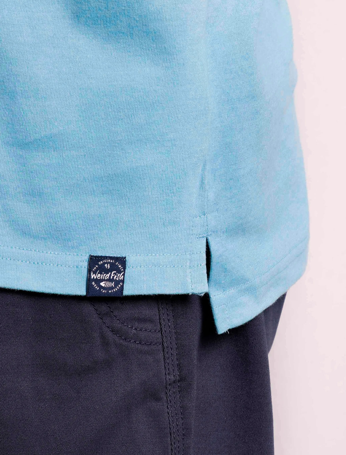 Sky Blue coloured men's Jetstream polo shirt from Weird Fish with hem logo label.