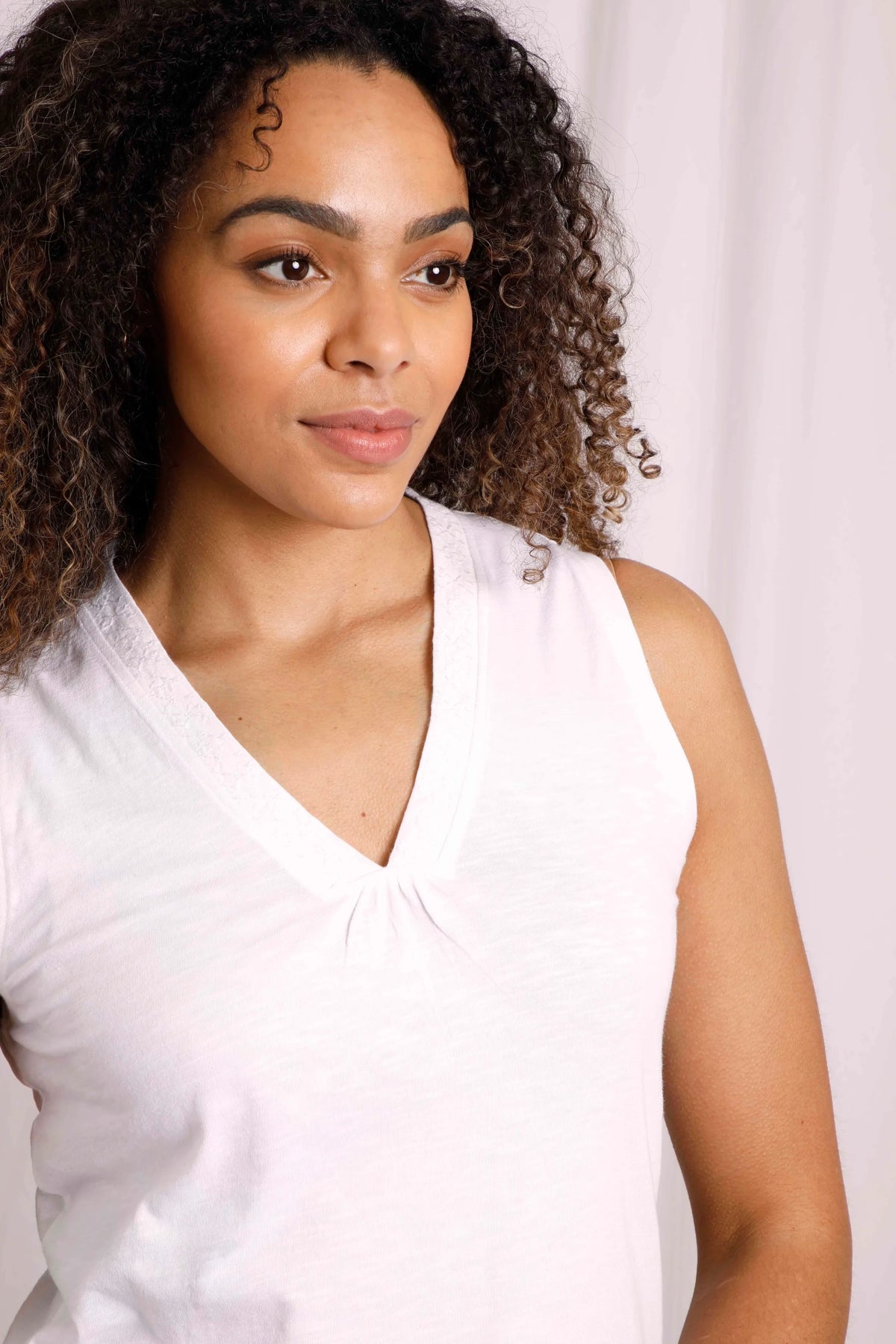 Women's white Arenas vest from Weird Fish with embroidered v-shape neckline.