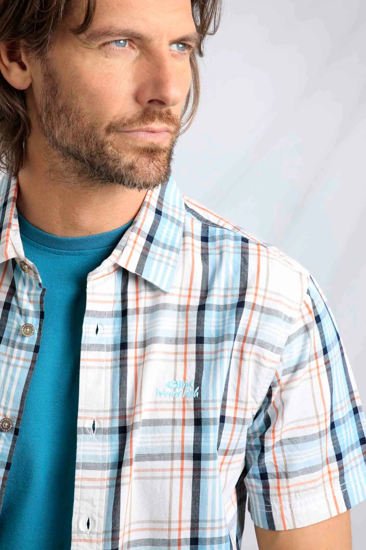 Weird Fish men's Judd short sleeve check shirt in an ecru, blue and orange pattern with embroidered chest logo.
