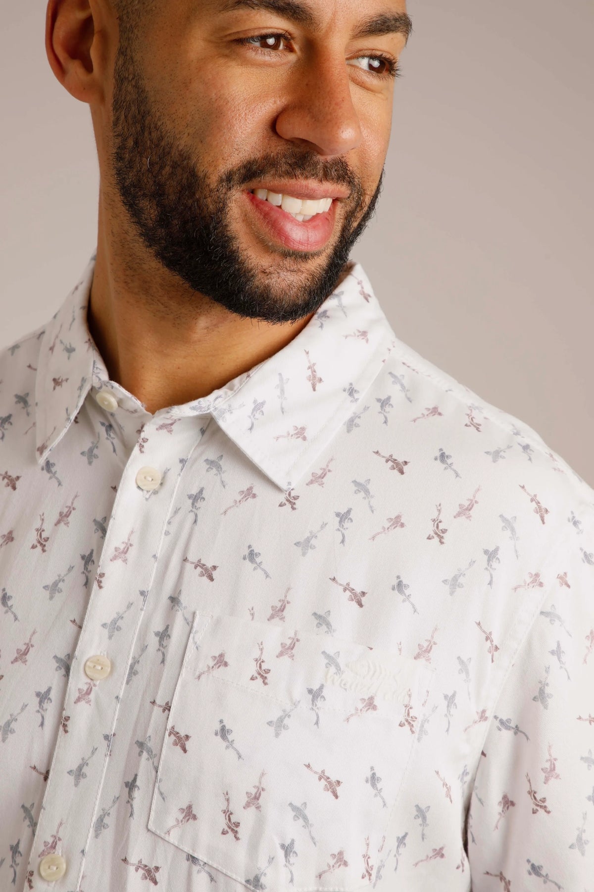 Button through men's white Keilor shirt from Weird Fish in white with a fish print pattern.