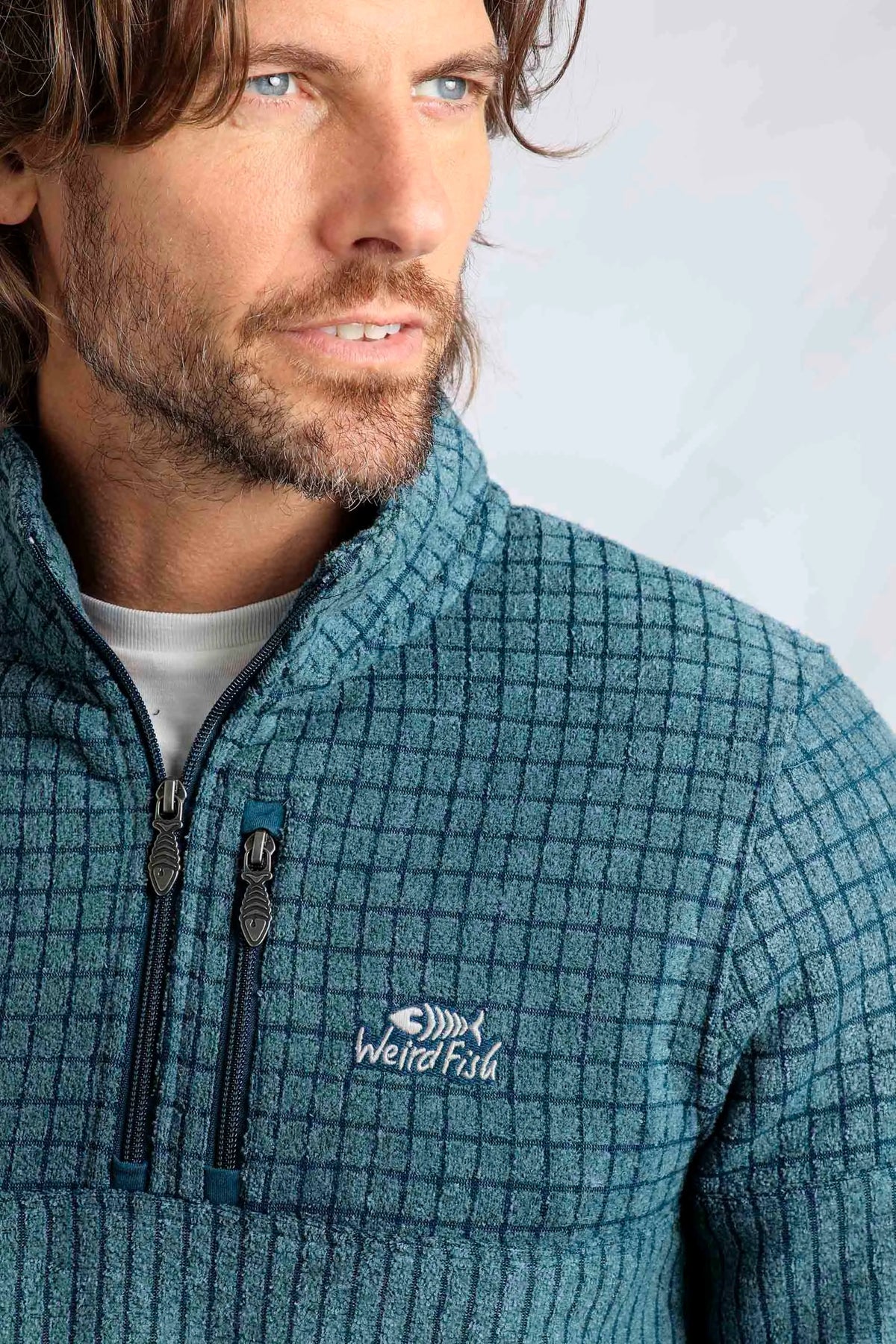 Weird Fish men's Longmont stripe grid textured fleece with chest zip pocket and logo in Deep Sea Blue.