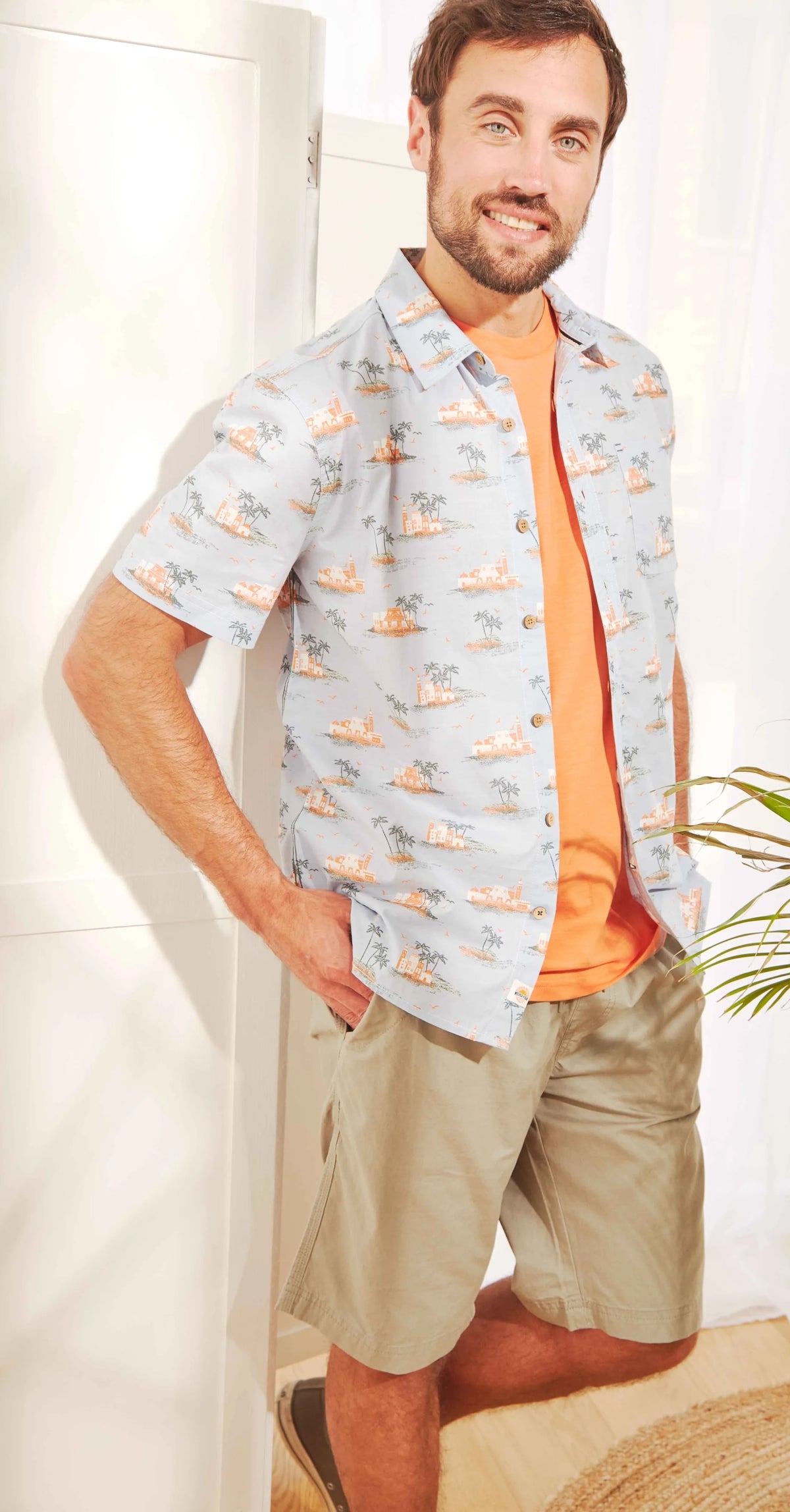 Pale Powder Blue Weird Fish short sleeve shirt with a tropical island print.