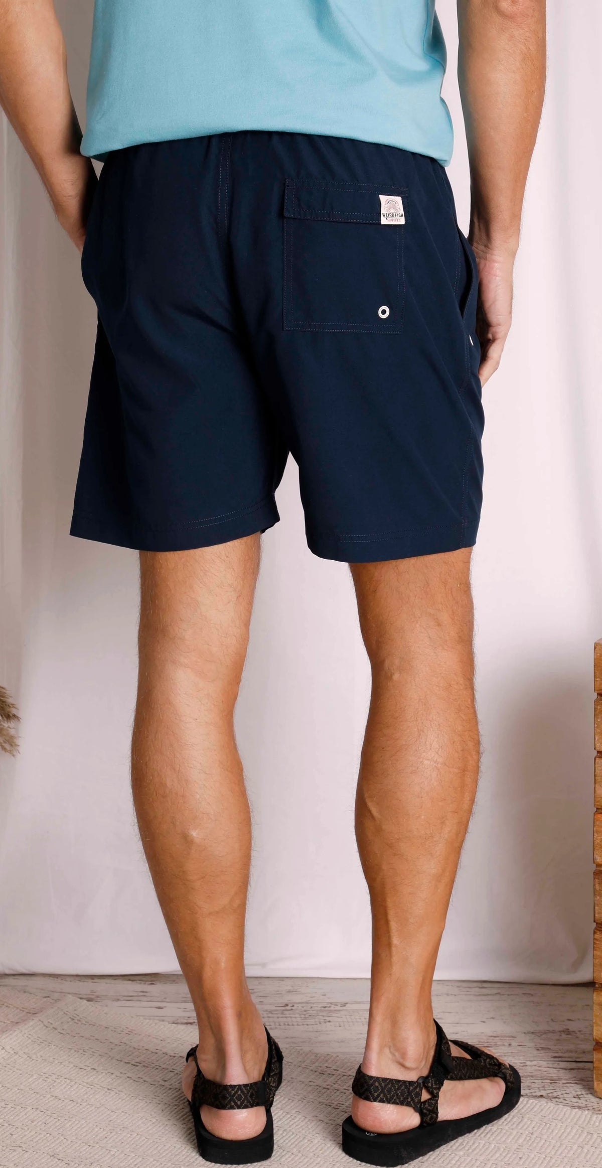 Weird Fish men's Banning swim shorts in Navy with Velcro back pocket.