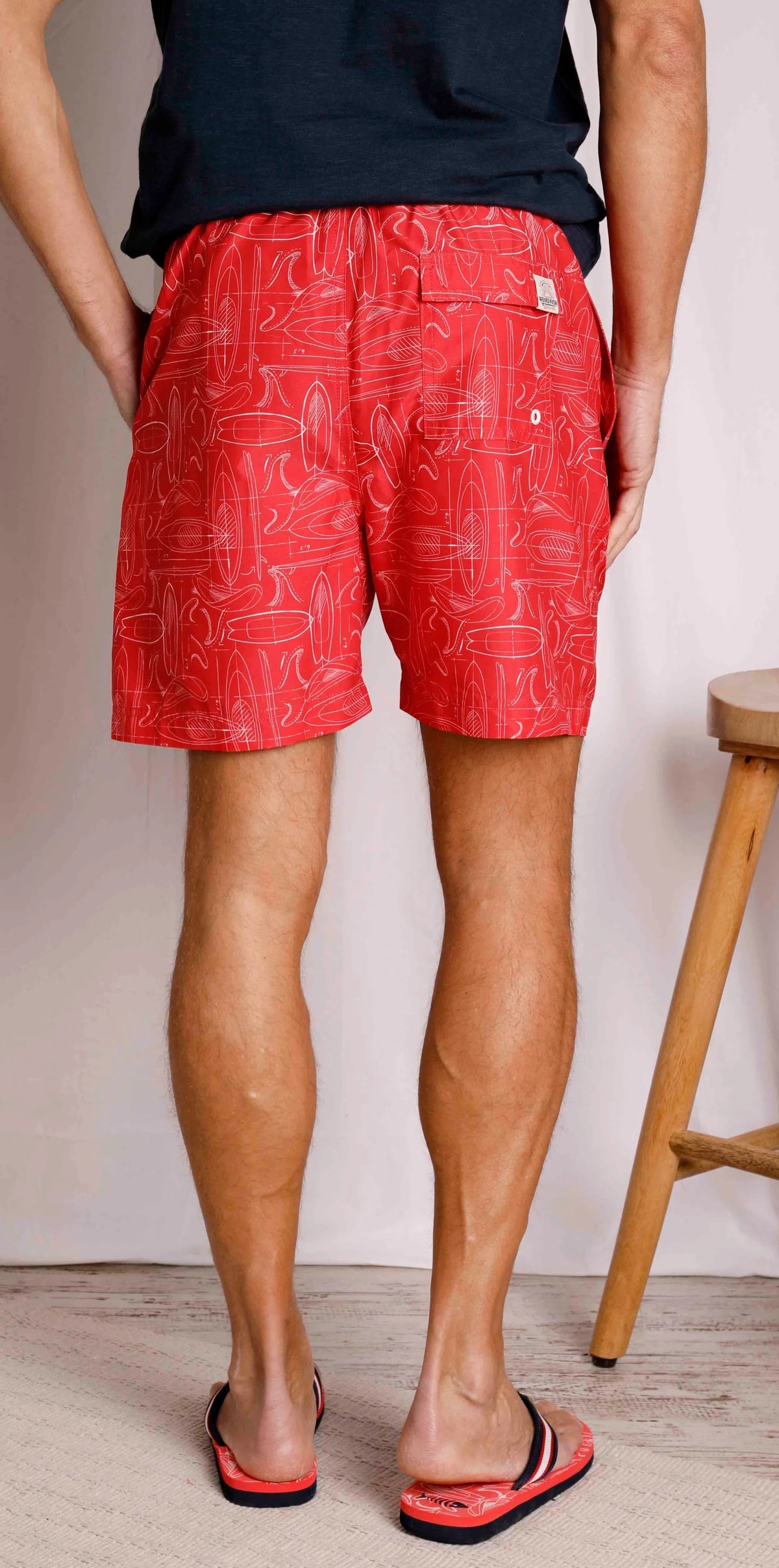 Men's Weird Fish Belukha elastic waist swim shorts in Radical Red with a surf board pattern.