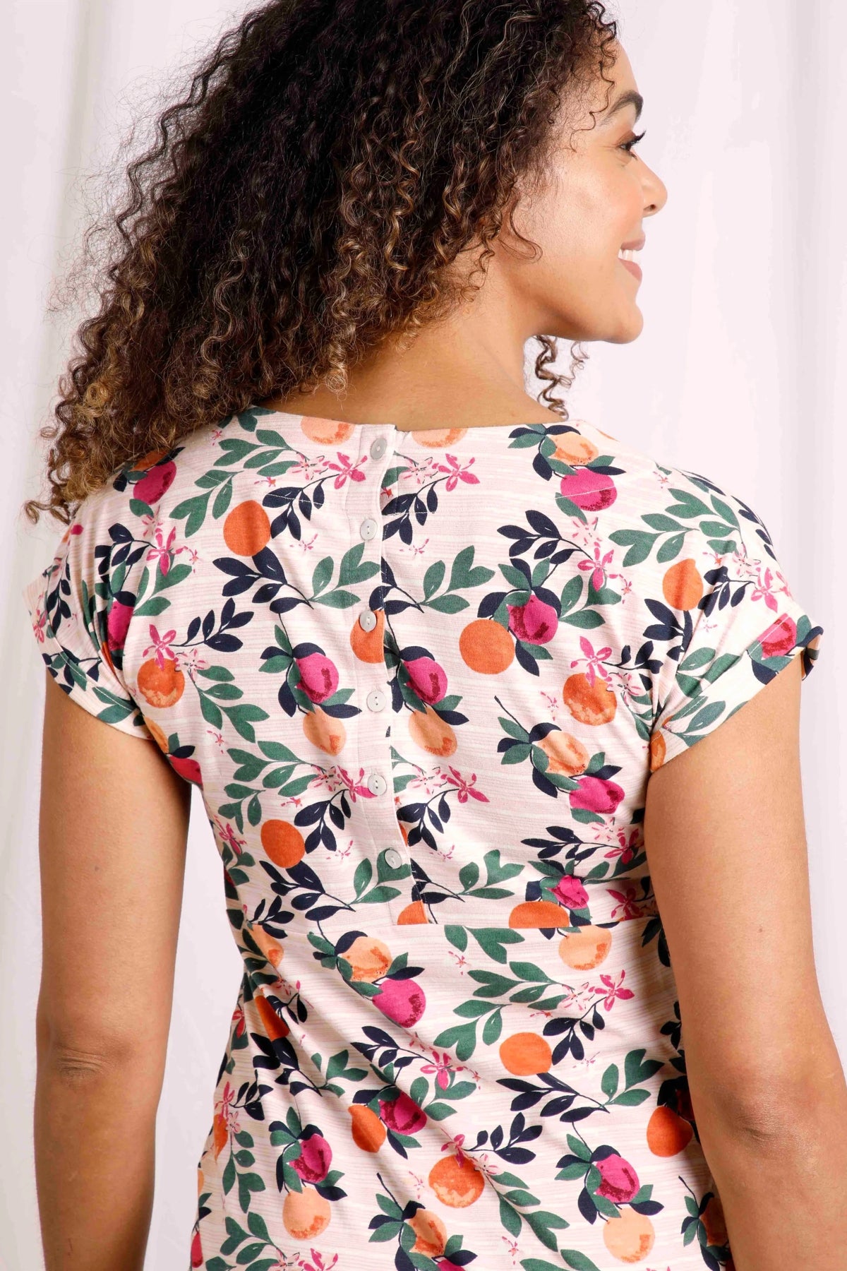 Weird Fish women's Tallhassee ccotton jersey dress in a Cantaloupe fruit pattern with buttons down the back.