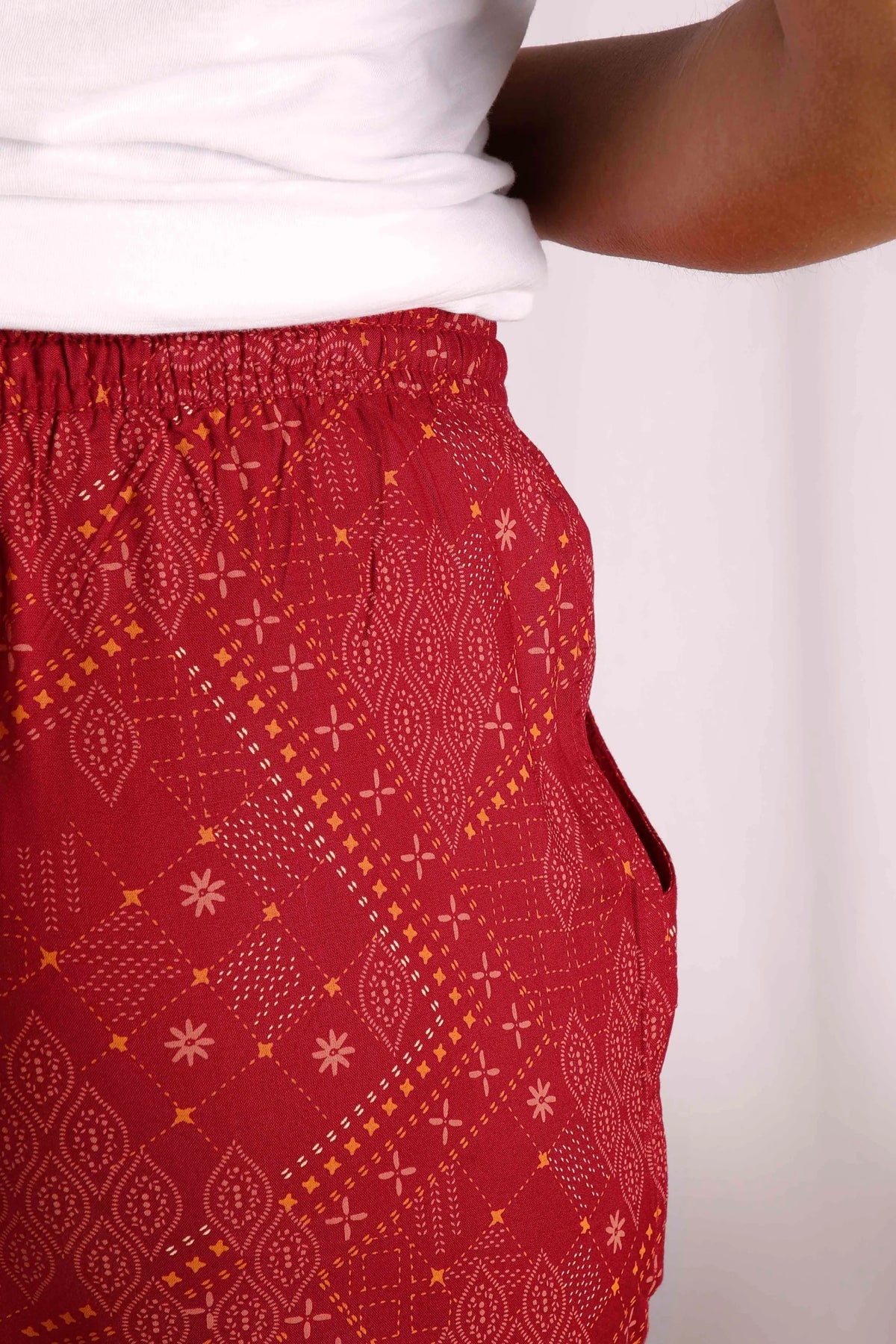 Weird Fish women's Chilli Red Tinto viscose trousers with elasticated waist and Moroccan style pattern.