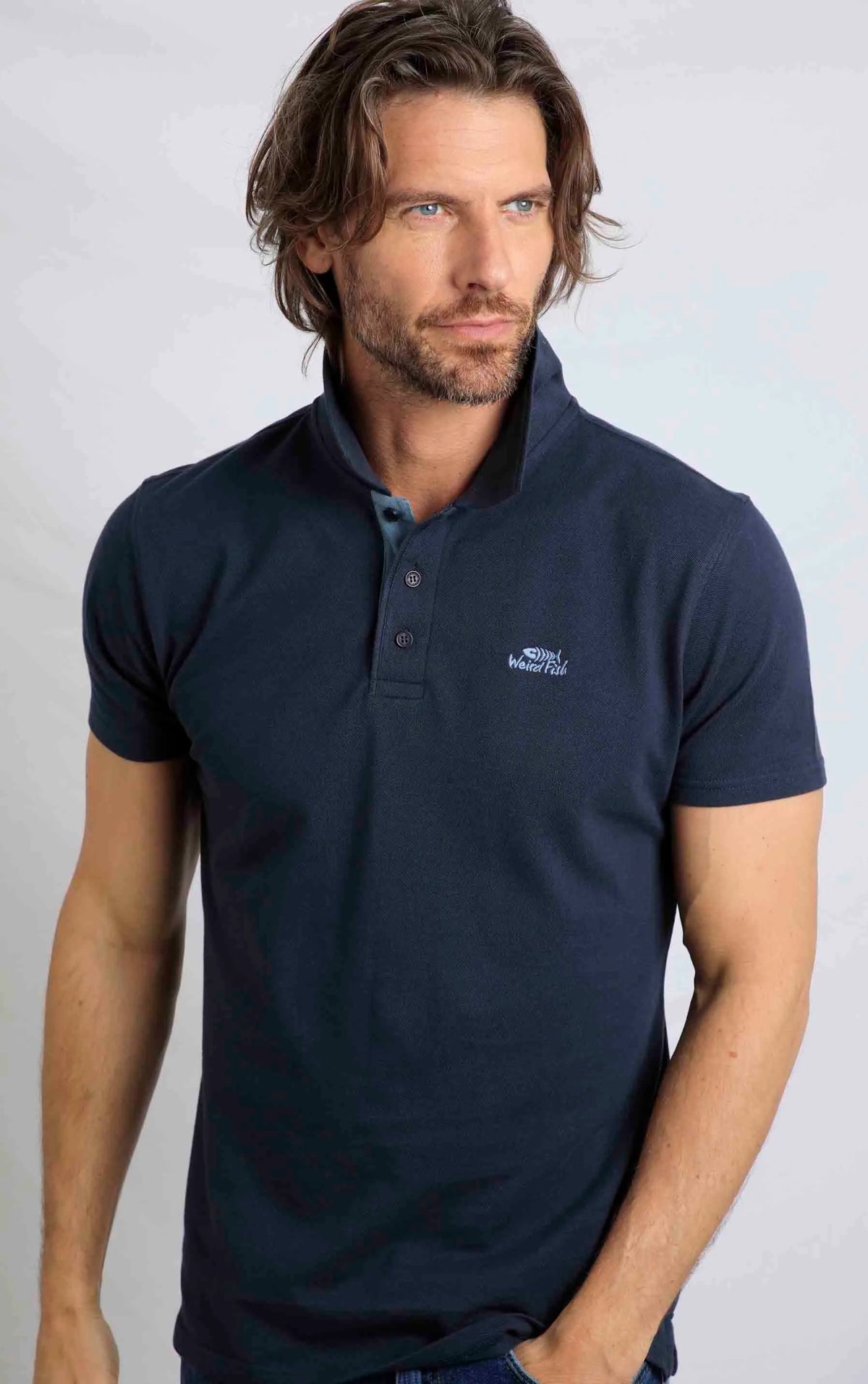 Weird Fish men's Miles pique short sleeve polo shirt in navy.