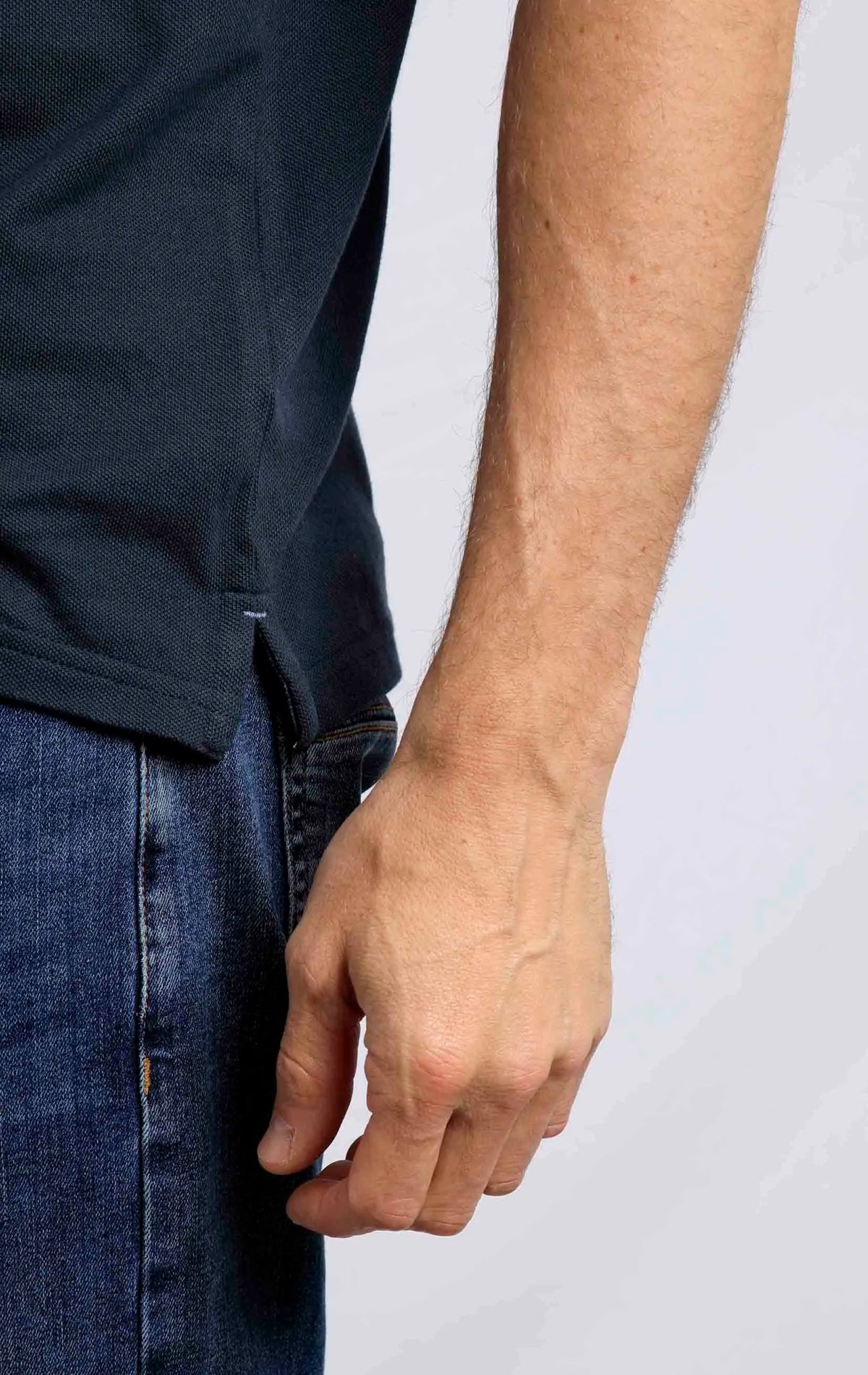 Weird Fish men's Miles pique polo shirt in Navy with side seam slits.