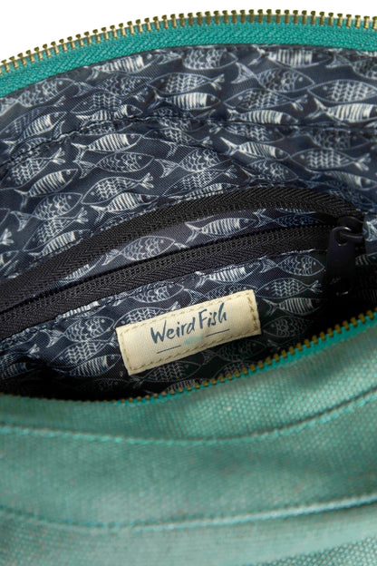 Weird Fish Ataca canvas cross body bag in Jade Green with fish print lining and internal zip pocket.