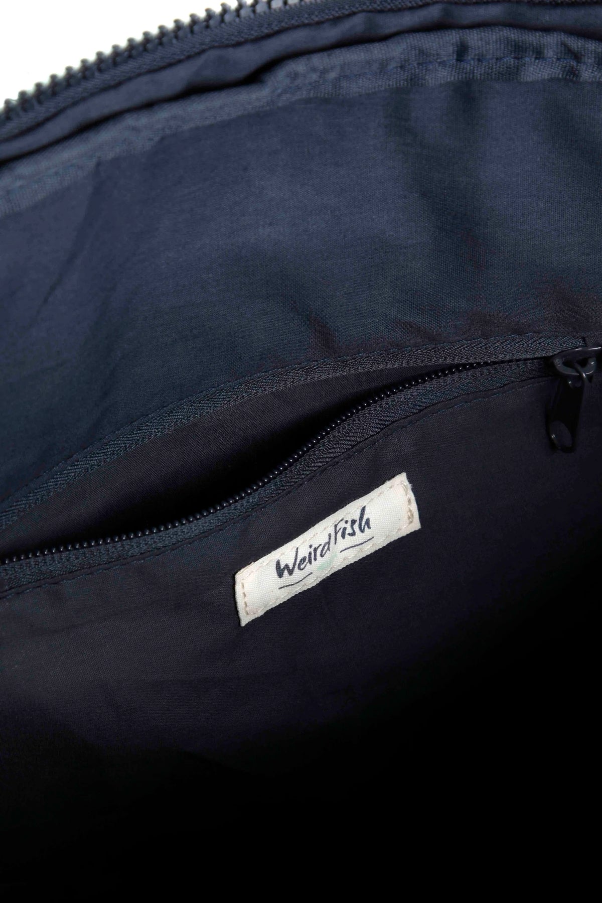 Nahla sketch style dog print backpack bag from Weird Fish in Dark Jade Green with internal zip pocket.